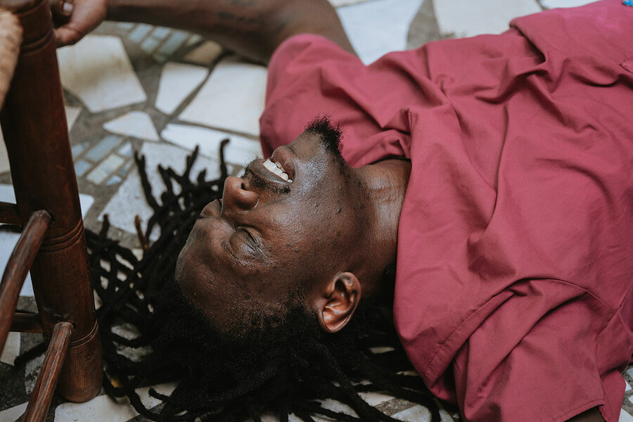 Actor Kav-Alye Pierre, playing a prison guard, is defeated in “Dechouke Lanfè sou Latè (Unleash Hell on Earth),” presented by Cie Hors-temps (Out of Time Company). The performance was part of the Quatre Chemins theater festival in Port-au-Prince, Haiti, which took place Nov. 21 to Dec. 3.