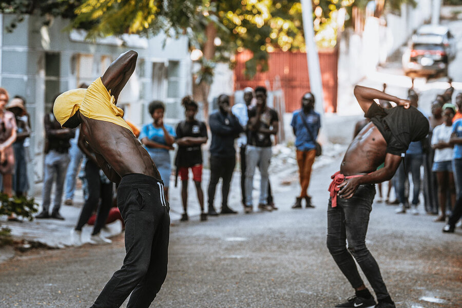 Actors perform “Inchallah,” choreographed by Daphné Menard. Their movements show the daily struggle of Haitians in the face of violence.